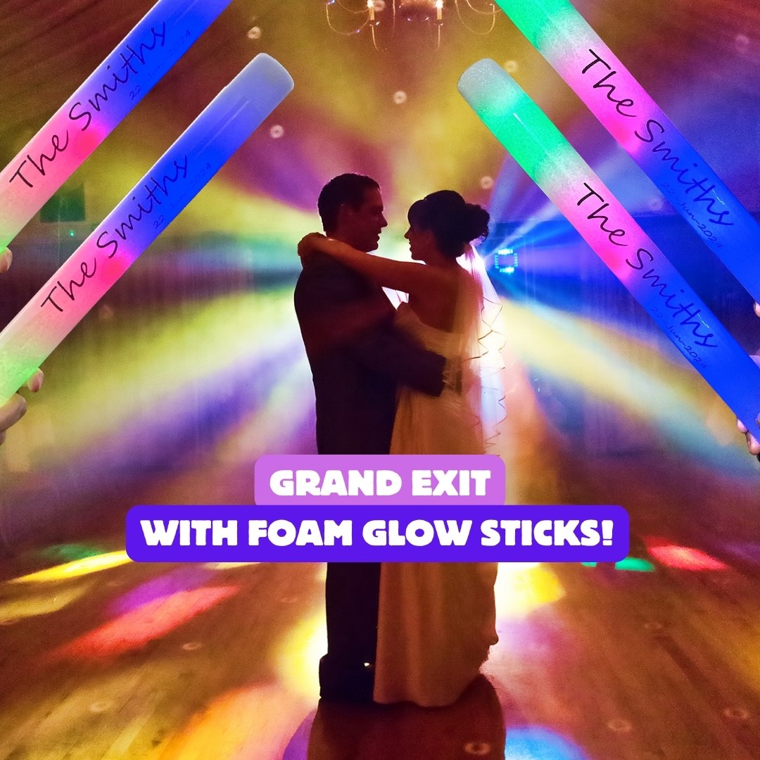 Couples and guests holding personalise glow sticks with heart-design, creating magical moments at a wedding